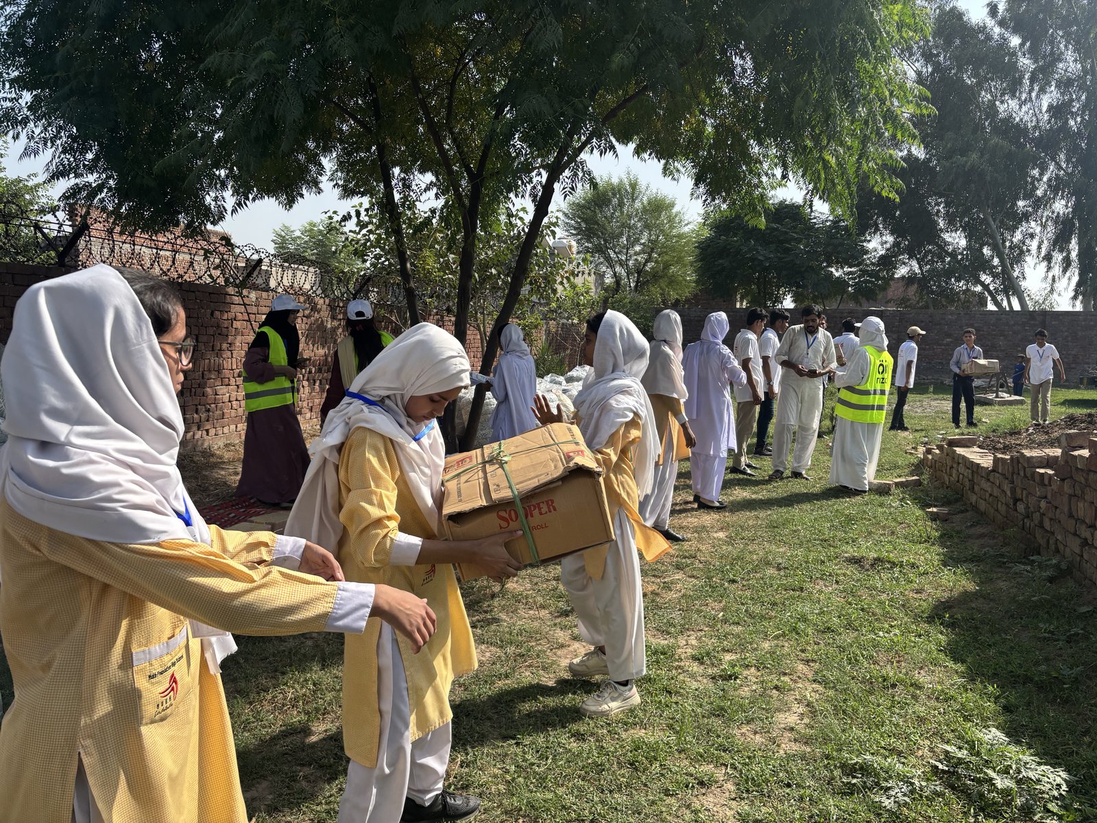 Community food distribution in Johar Town, Lahore
